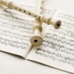 flutes-over-musical-notes_1385-640
